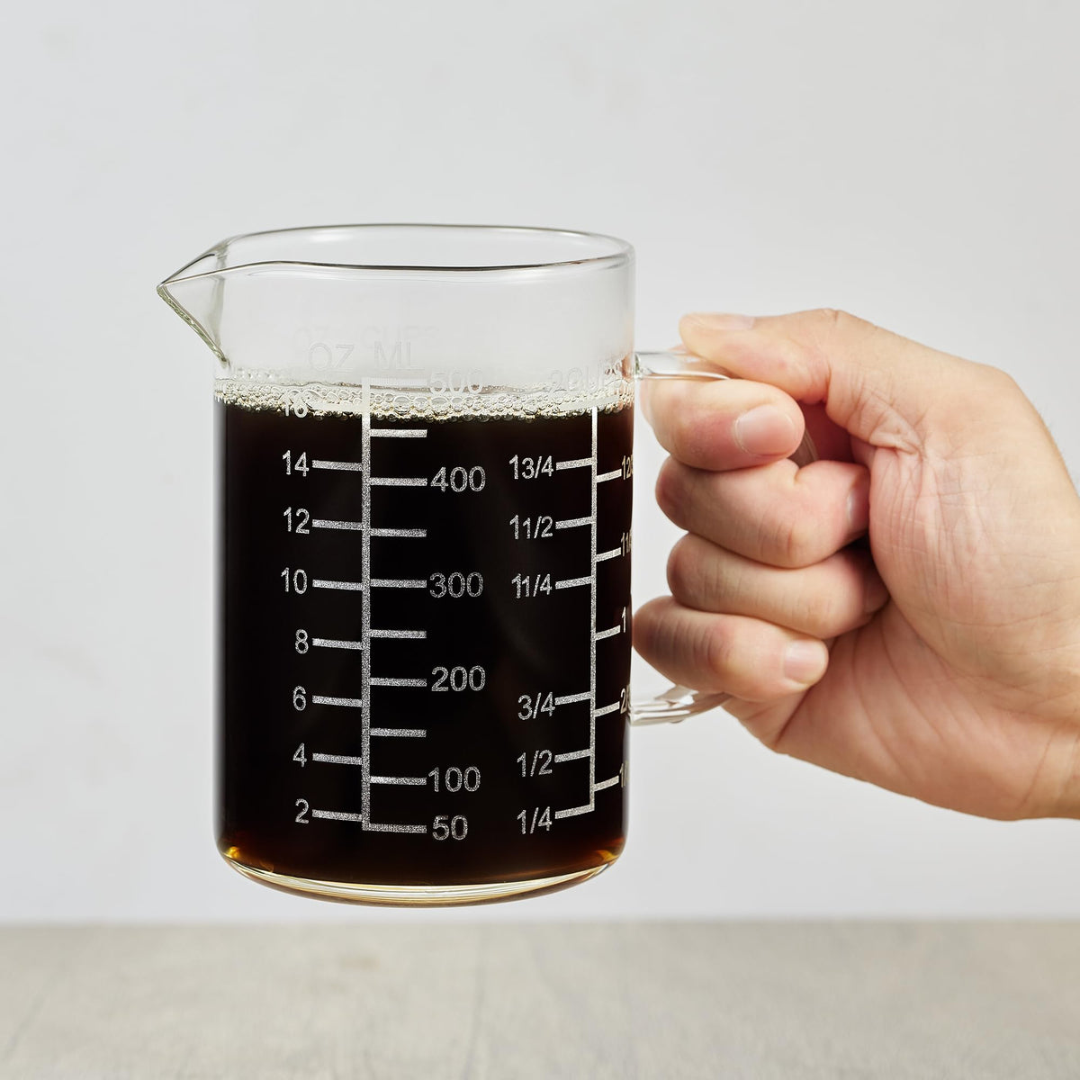 Ackers BORO3.3 glass cup front view with etched scales for precise measurement