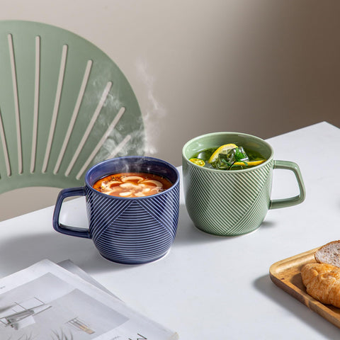 Adewnest 32oz green mug full cup ideal for coffee or cocoa.