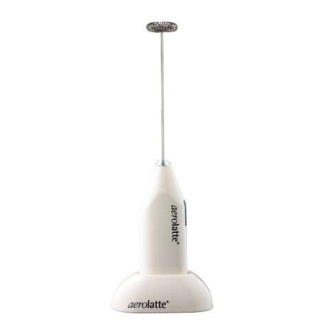Aerolatte milk frother ivory with counter stand for quick, creamy foam.