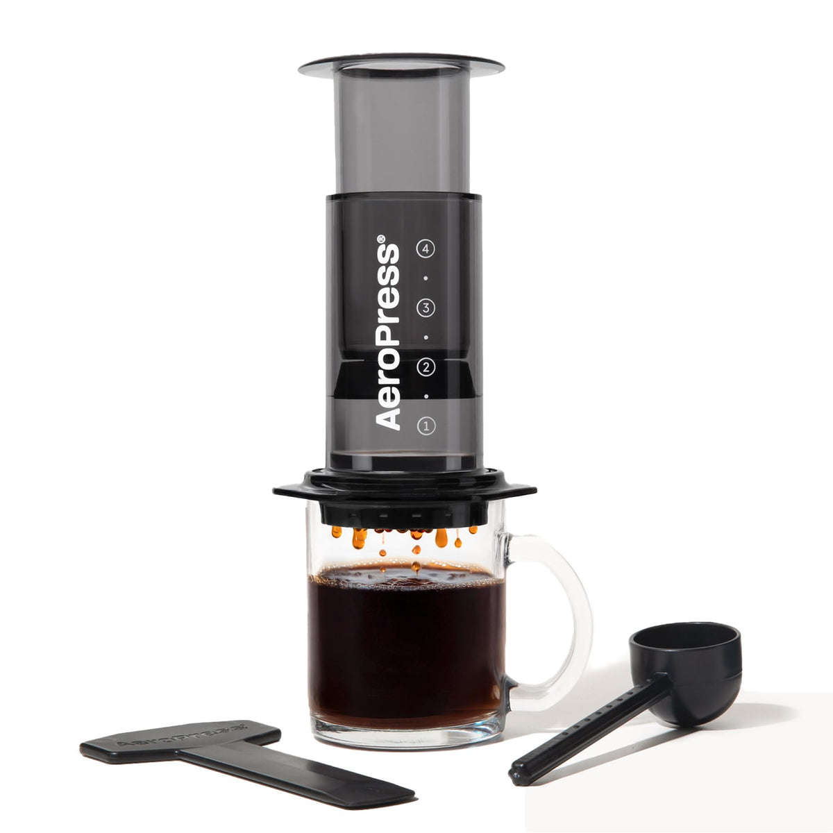 AeroPress Clear Black Coffee Press front view shows a portable, shatterproof brewer for on-the-go use.