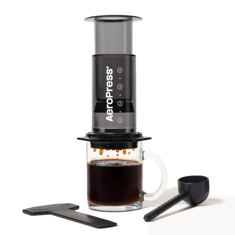 AeroPress Clear Black Coffee Press front view shows a portable, shatterproof brewer for on-the-go use.