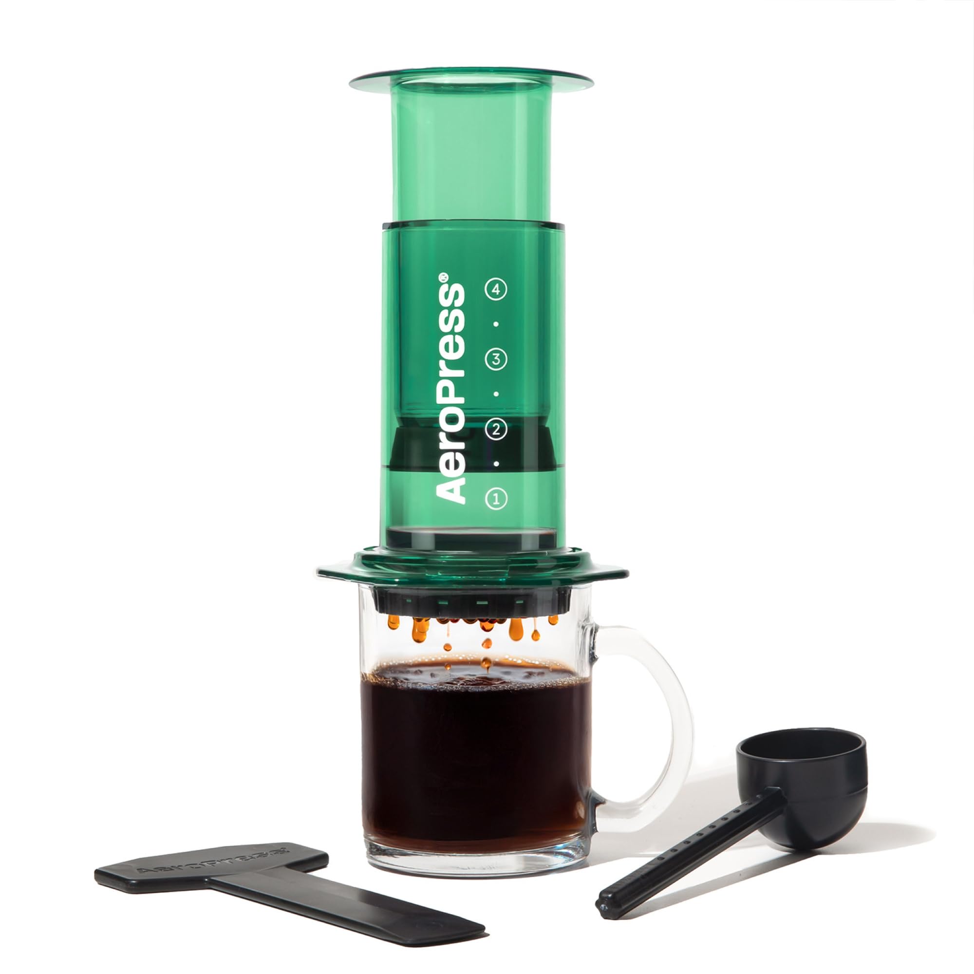 AeroPress Clear Green with Tritan body shows durable, see-through brewing for on-the-go coffee.