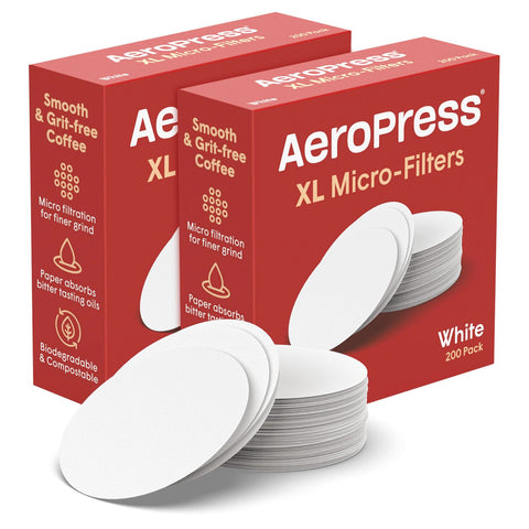 AeroPress XL coffee maker with white filters ready for clean brewing