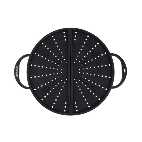 AirHood foldable silicone splatter screen over pan, protecting counters from grease.