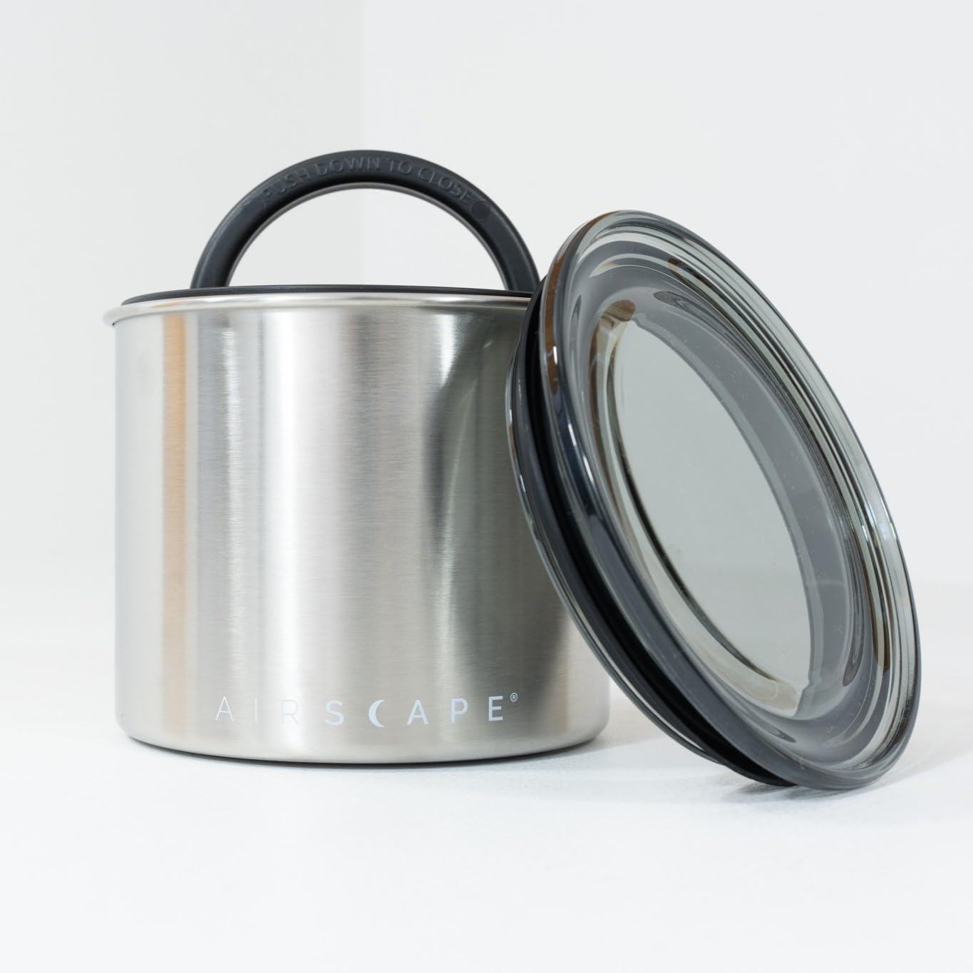 Close-up of AirScape airtight lid in brushed steel showing secure seal.