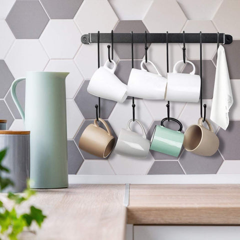 AJART black steel mug holder with a sleek design for stylish kitchen organization.