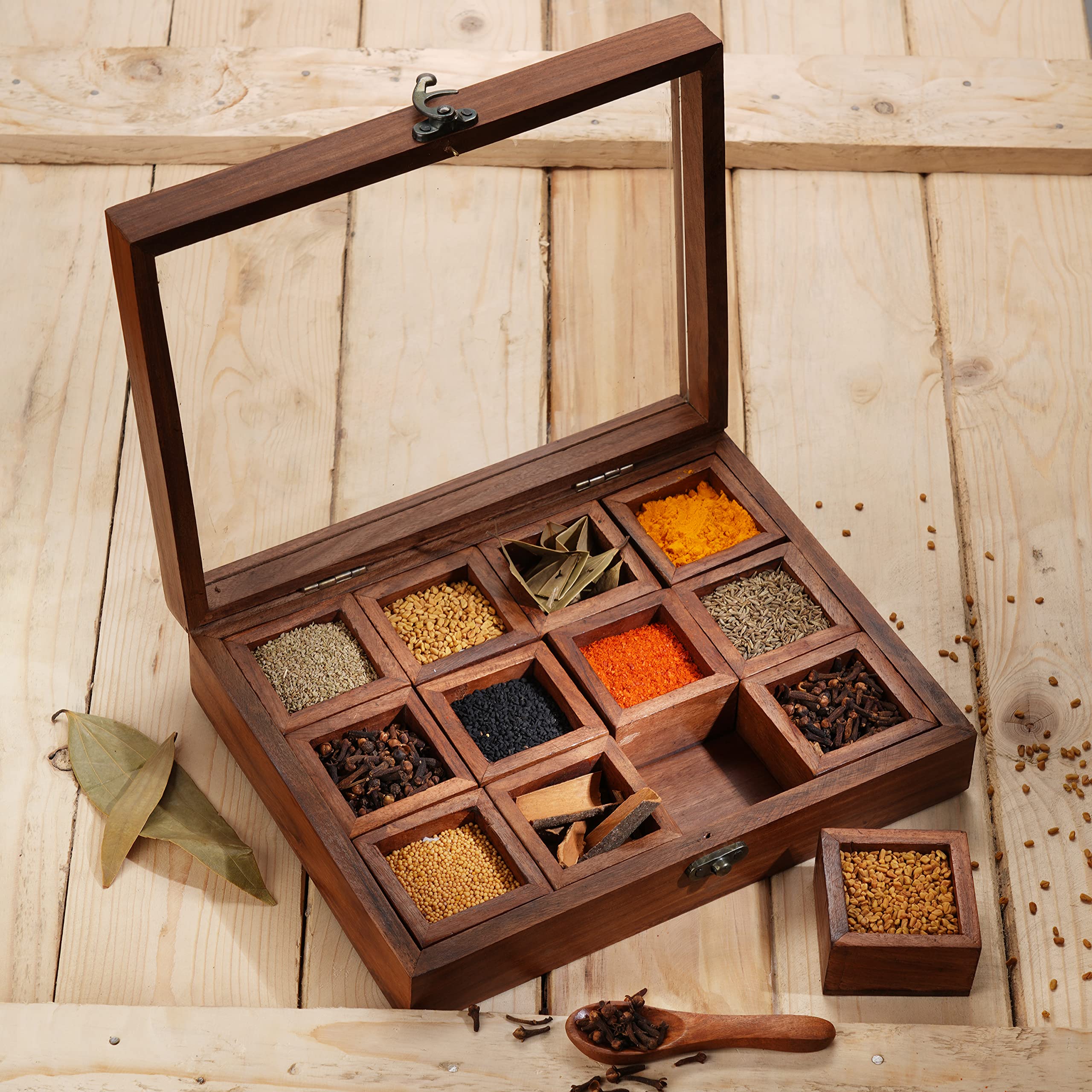 Ajuny wooden spice box with 12 compartments visible through glass lid for quick spice selection.