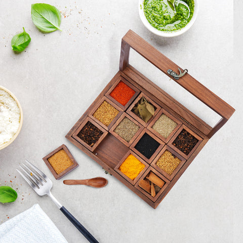 Ajuny masala dabba shows organized spices under a clear lid for easy identification.