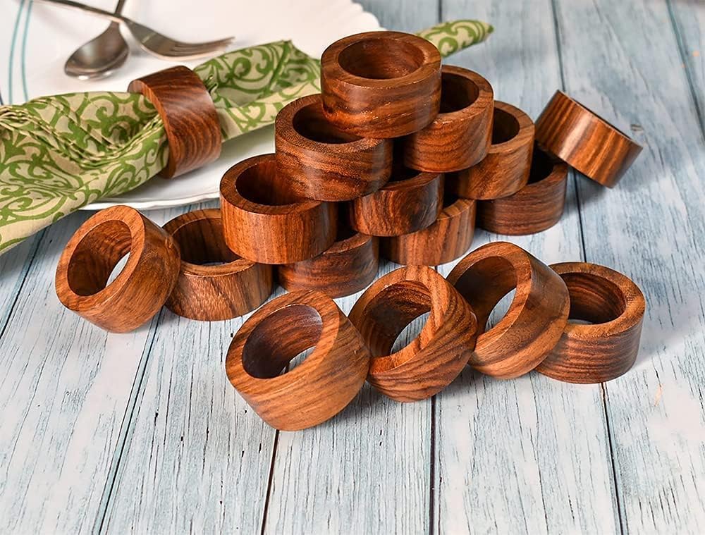 Ajuny napkin rings arranged on a dining table for a party setup.