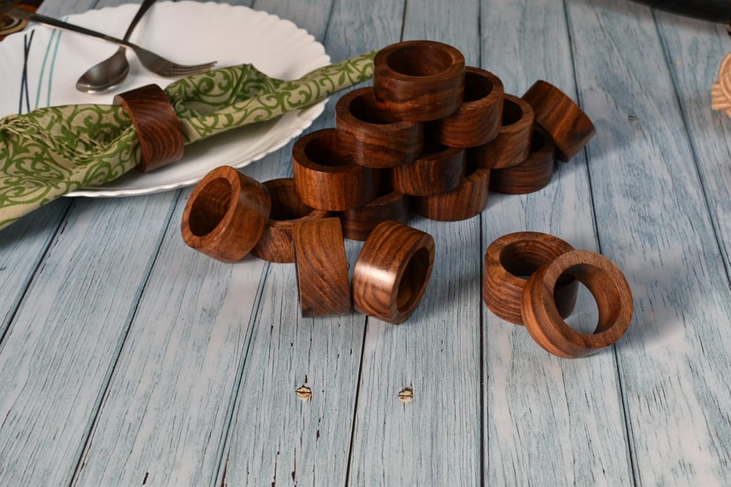 Ajuny handmade wooden rings highlighting natural wood grain texture.