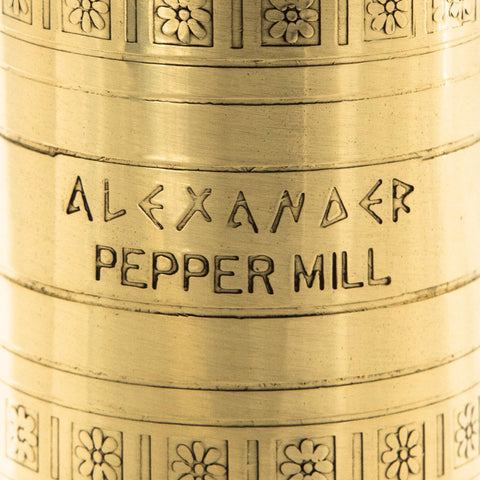 Alexander Home pepper mill with flanged base for stable grinding on any surface.
