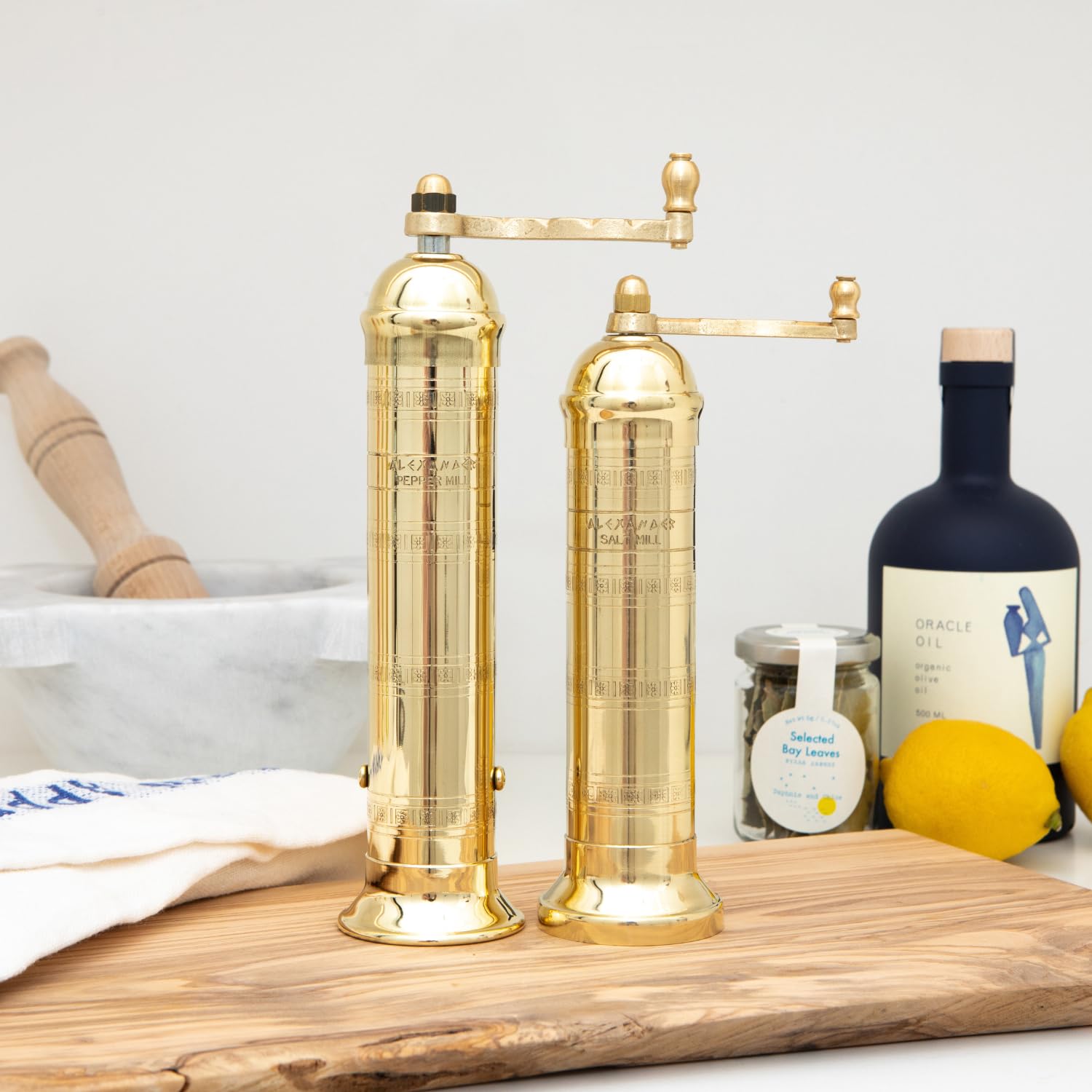 Alexander Home handmade brass pepper mill finish showing unique artisan character.