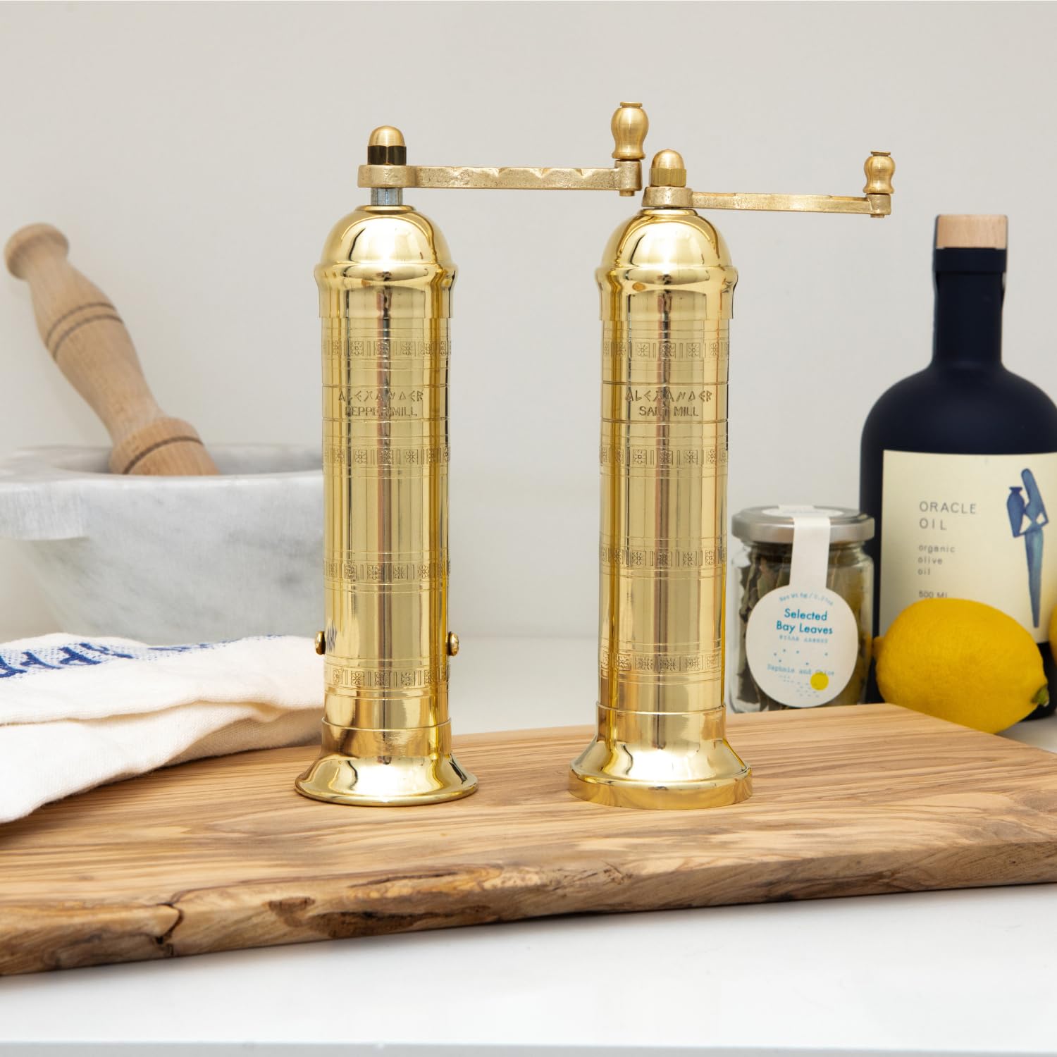 Brass handle on the mill enables smooth, controlled cranking during meal prep.