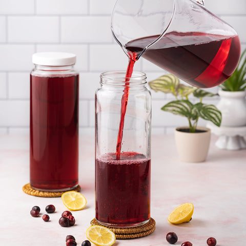 All About Juicing glass bottle for pantry organization and easy access.