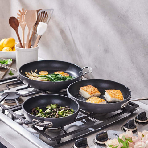 All-Clad black nonstick 12-inch skillet 1234 surface close-up for effortless cooking cleanup.