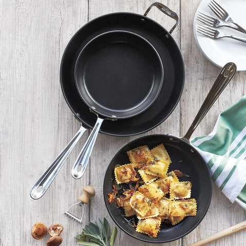 All-Clad black nonstick 12-inch skillet interior ready for quick release and cleanup.