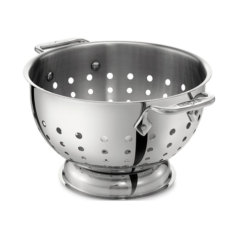 All-Clad 5 Qt colander with mirror finish for rinsing vegetables.