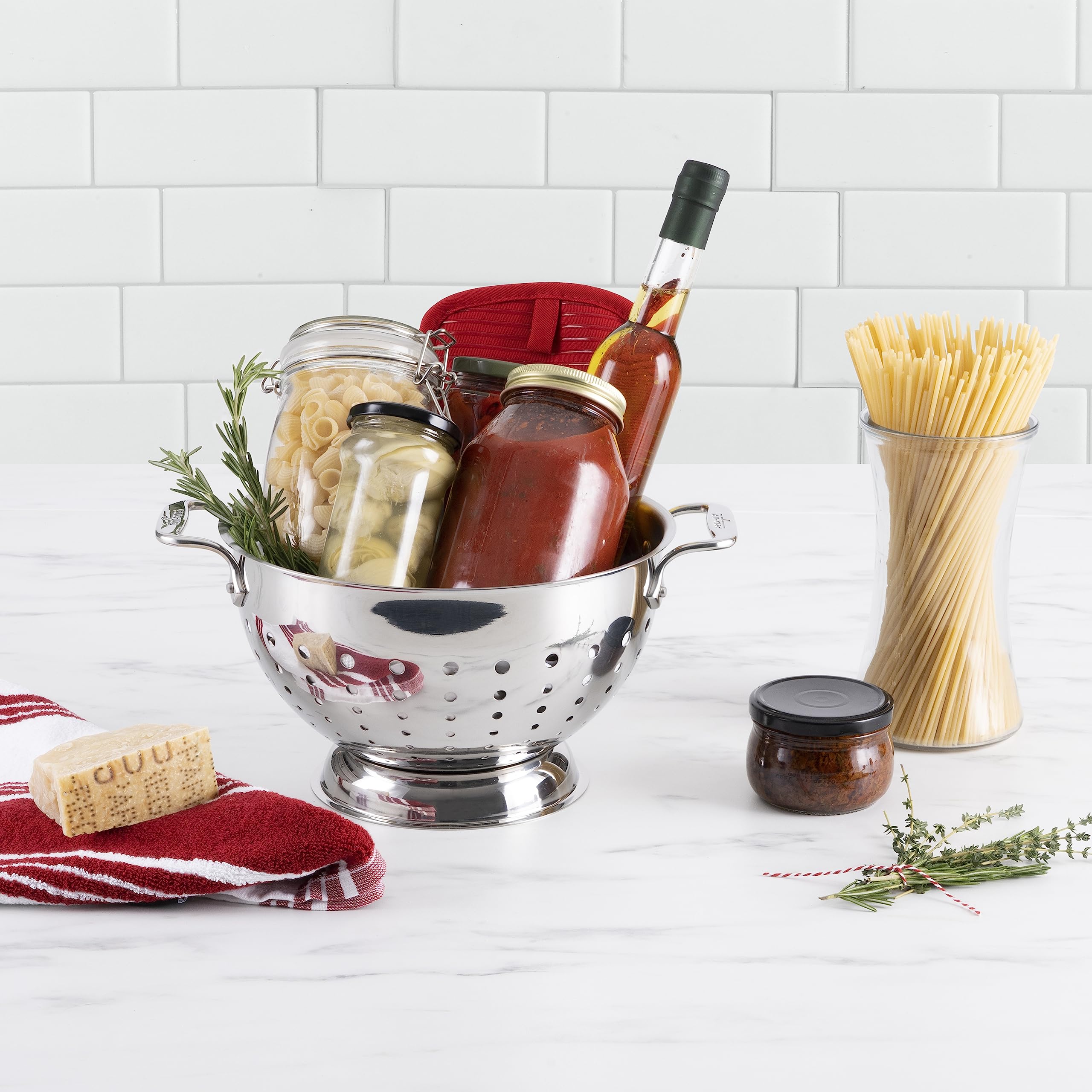 All-Clad colander rests on a pedestal base for added stability.