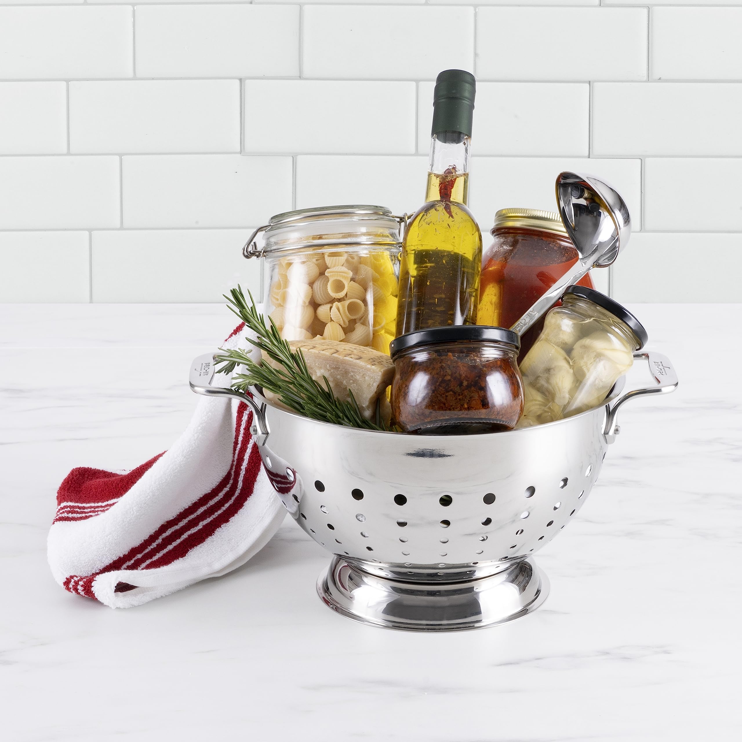 All-Clad colander with riveted handles for a secure grip during draining.
