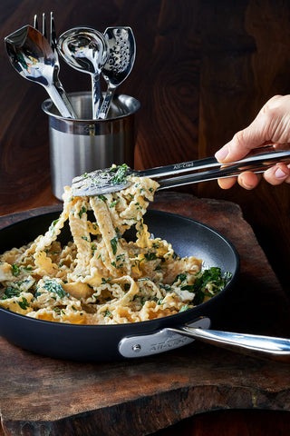 All-Clad ergonomic handle promotes comfortable grip during flipping and serving.