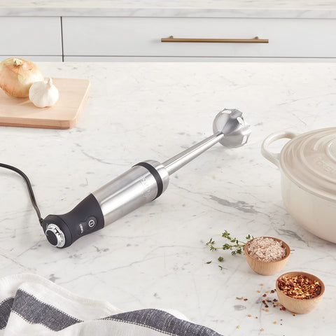 All-Clad immersion blender with variable-speed control for precise texture in sauces.