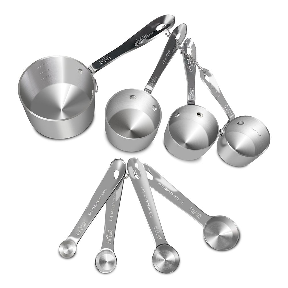 All-Clad measuring cups 1/4 cup—precise portions for quick batter prep.