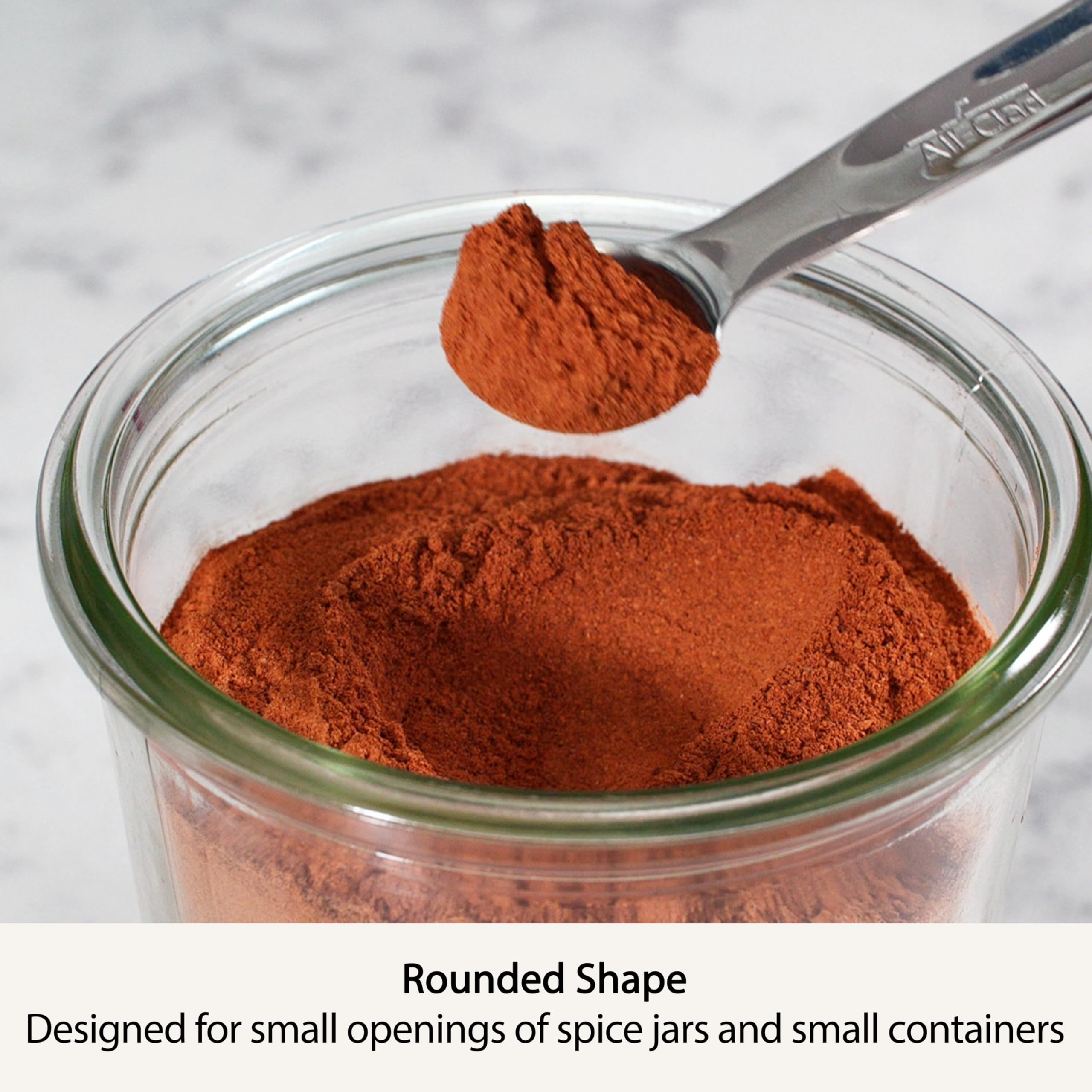 All-Clad measuring spoons glide into spice jars for tidy, spill-free scooping.