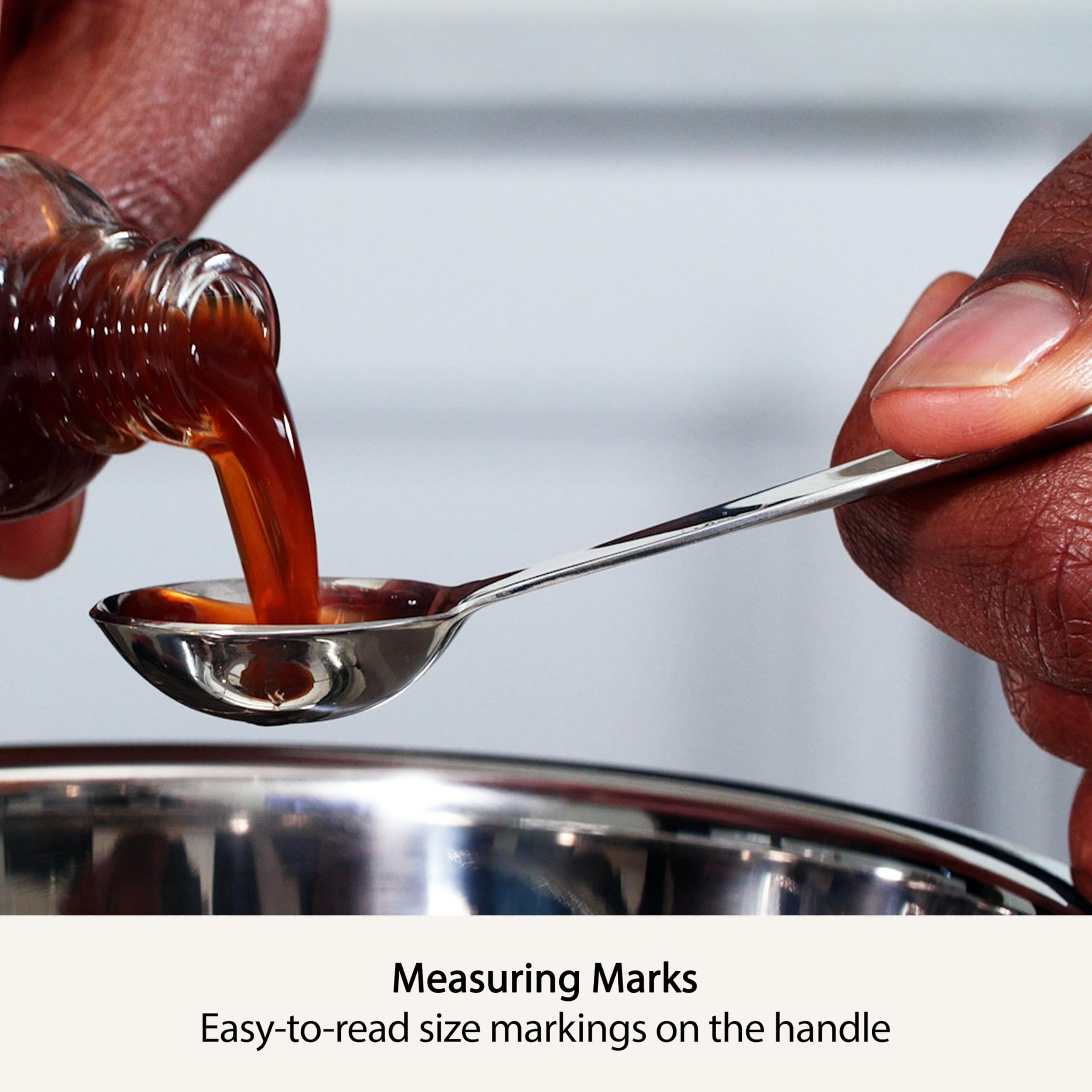 All-Clad spoons linked in a chain keep the set together for fast grabbing.