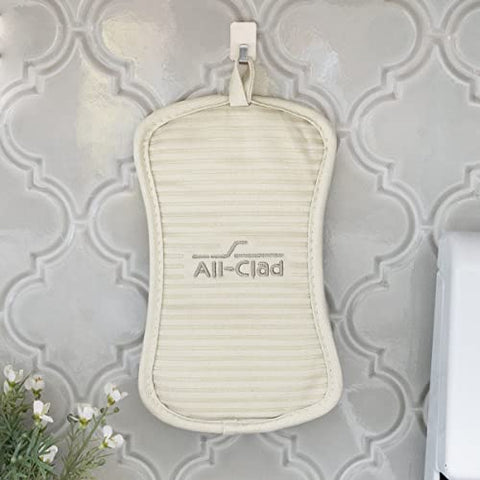 All-Clad almond color pot holder complements any kitchen decor.