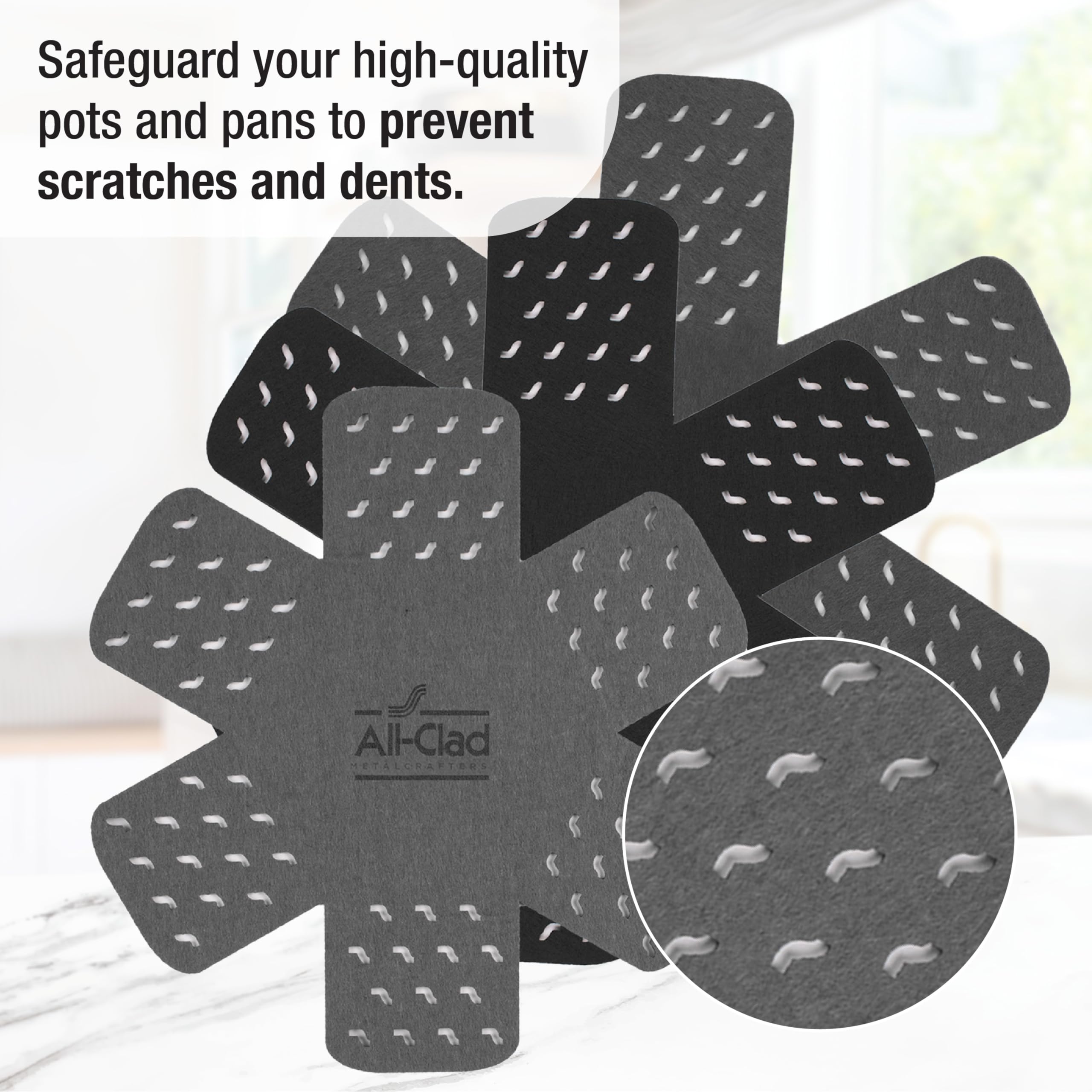 All-Clad pot protectors with star pattern fit 18-inch cookware and cushion surfaces.