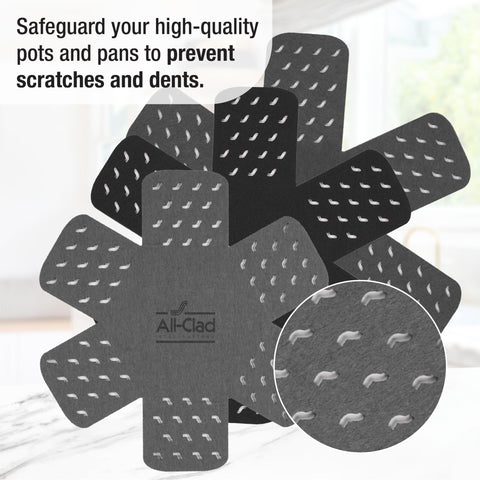 All-Clad pot protectors with star pattern fit 18-inch cookware and cushion surfaces.