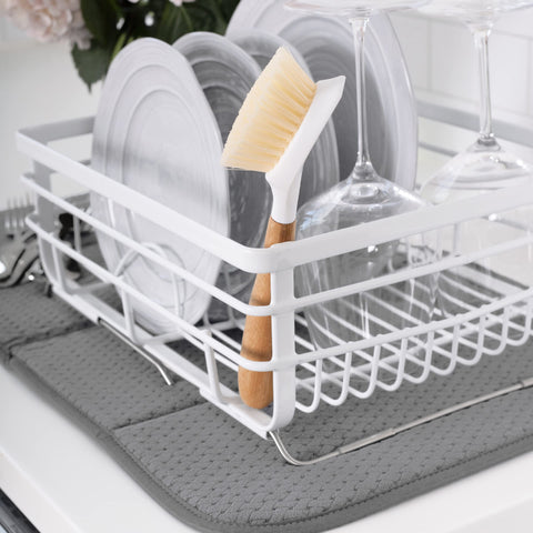 All-Clad dish drying mat folded for compact storage after use