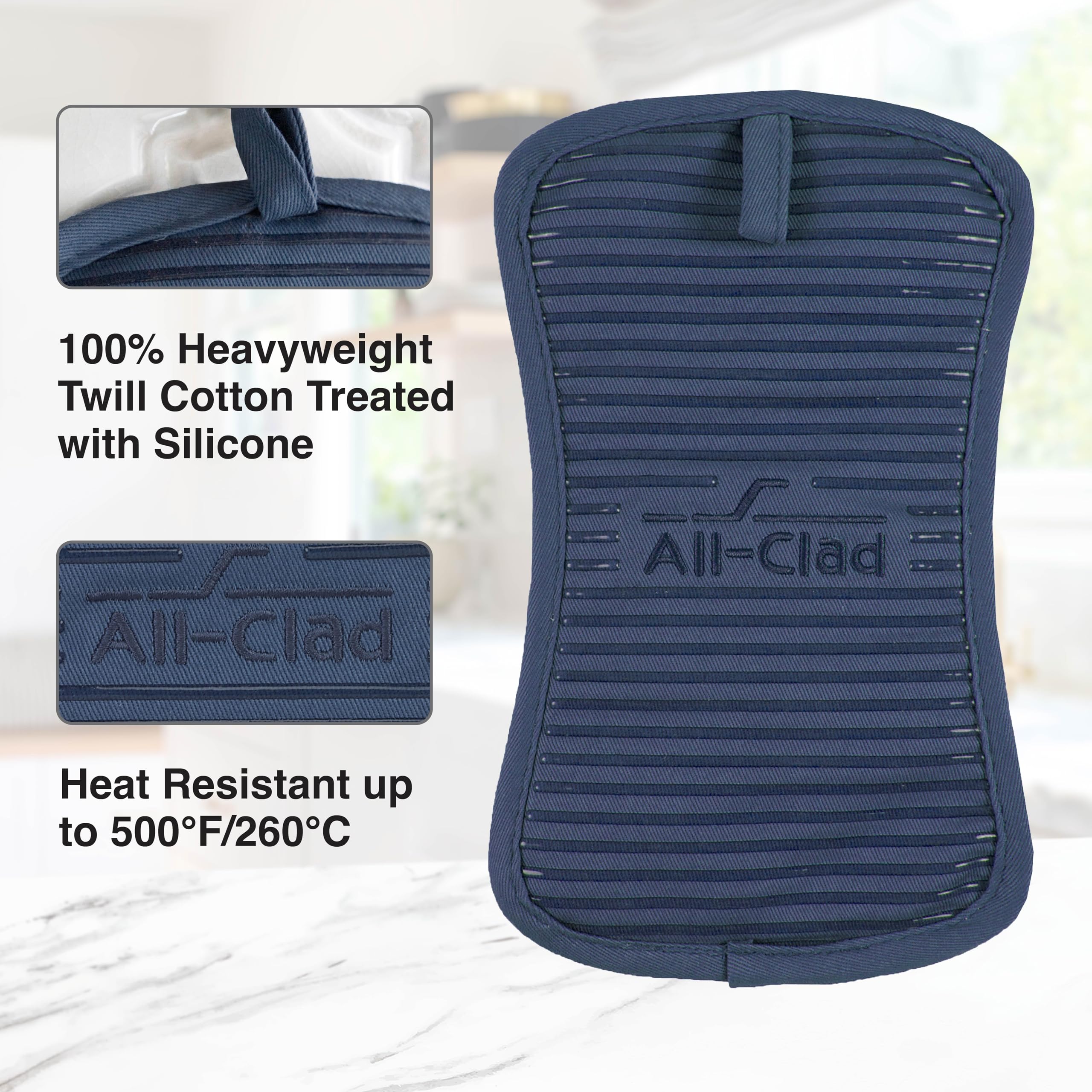 Ergonomic design of All-Clad indigo pot holder fits various pans for comfortable handling.