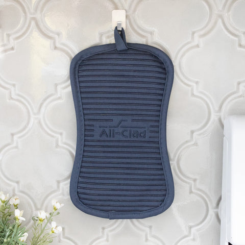 All-Clad indigo pot holder protects countertops during transfers of hot cookware.