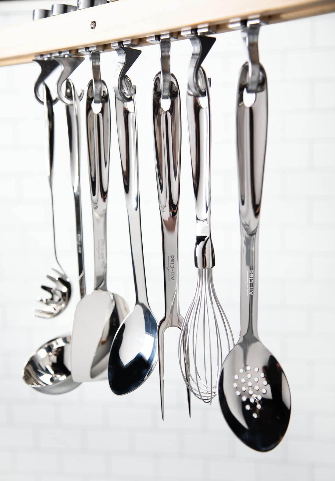 All-Clad slotted turner ergonomic handle provides comfortable grip during cooking.