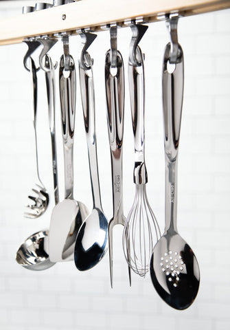 All-Clad slotted turner ergonomic handle provides comfortable grip during cooking.