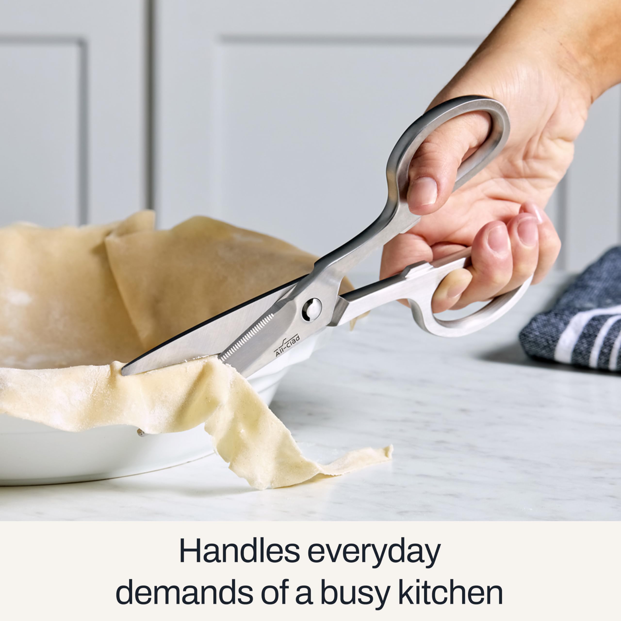 All-Clad kitchen shears cutting twine and parchment for prep and packaging.