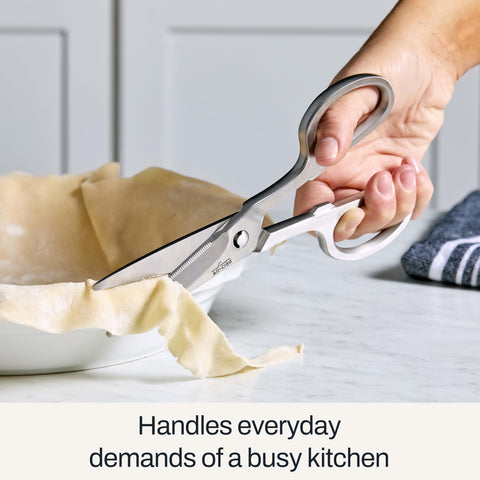 All-Clad kitchen shears cutting twine and parchment for prep and packaging.