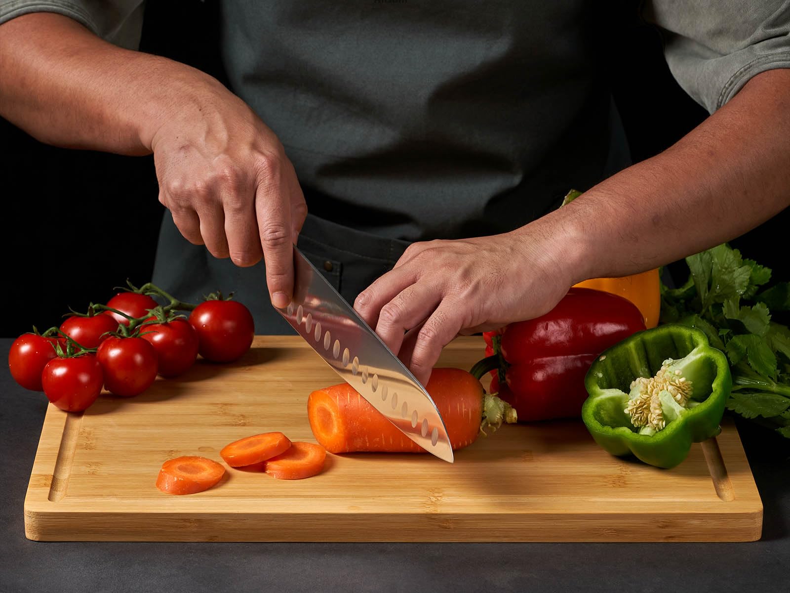Allsum over-sink bamboo board keeps counters dry during meal prep.