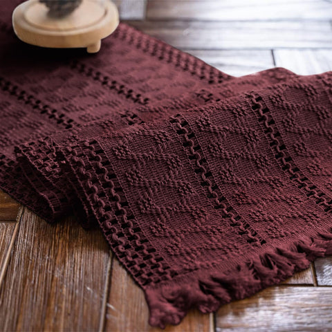 Alynsehom burgundy macrame table runner with tassels enhances boho dining ambiance.