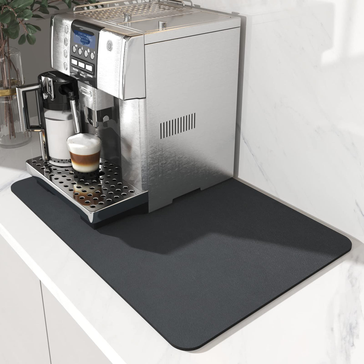 AMOAMI Coffee Mat sits under the coffee maker to keep counters clean and dry.