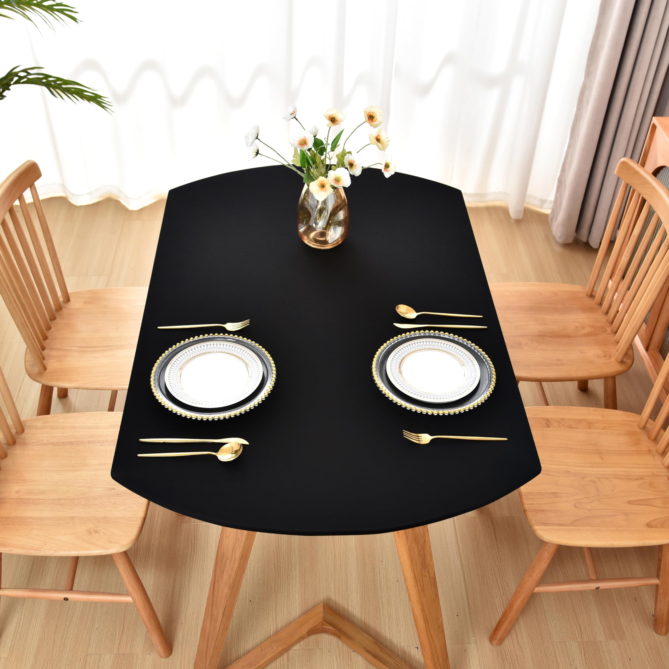 Amonsa oval black fitted tablecloth drapes cleanly for a refined look