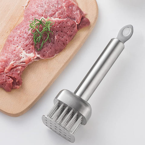 AMPSEVEN tenderizer cleaning with brush after use.