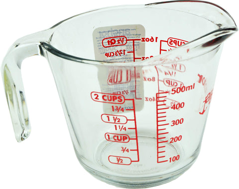 Anchor Hocking measuring cup with handle and spout, durable glass for heating and pouring.