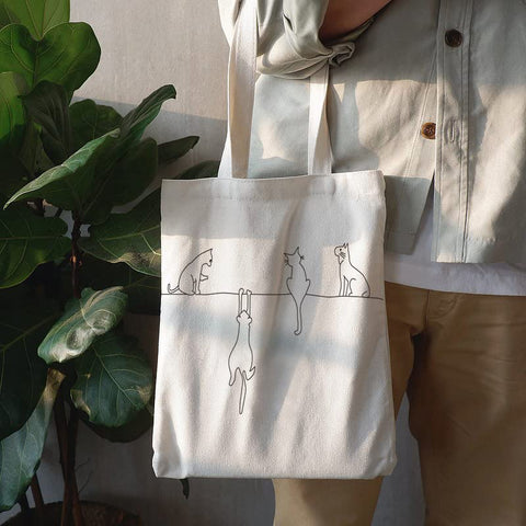 Andes tote with side pockets organized for groceries and tech