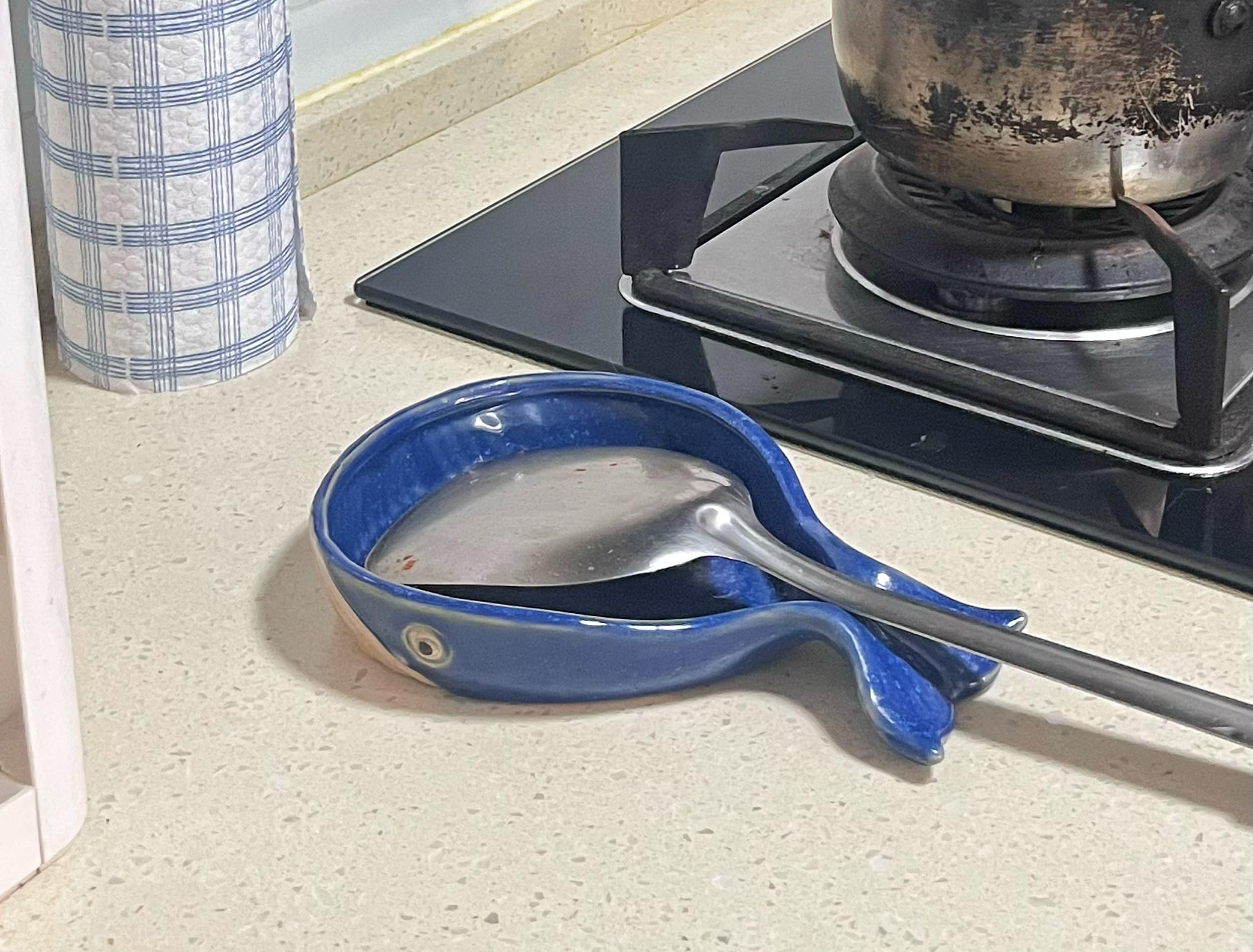 ANLYAWX deep-bowl spoon rest with non-slip base stays in place.