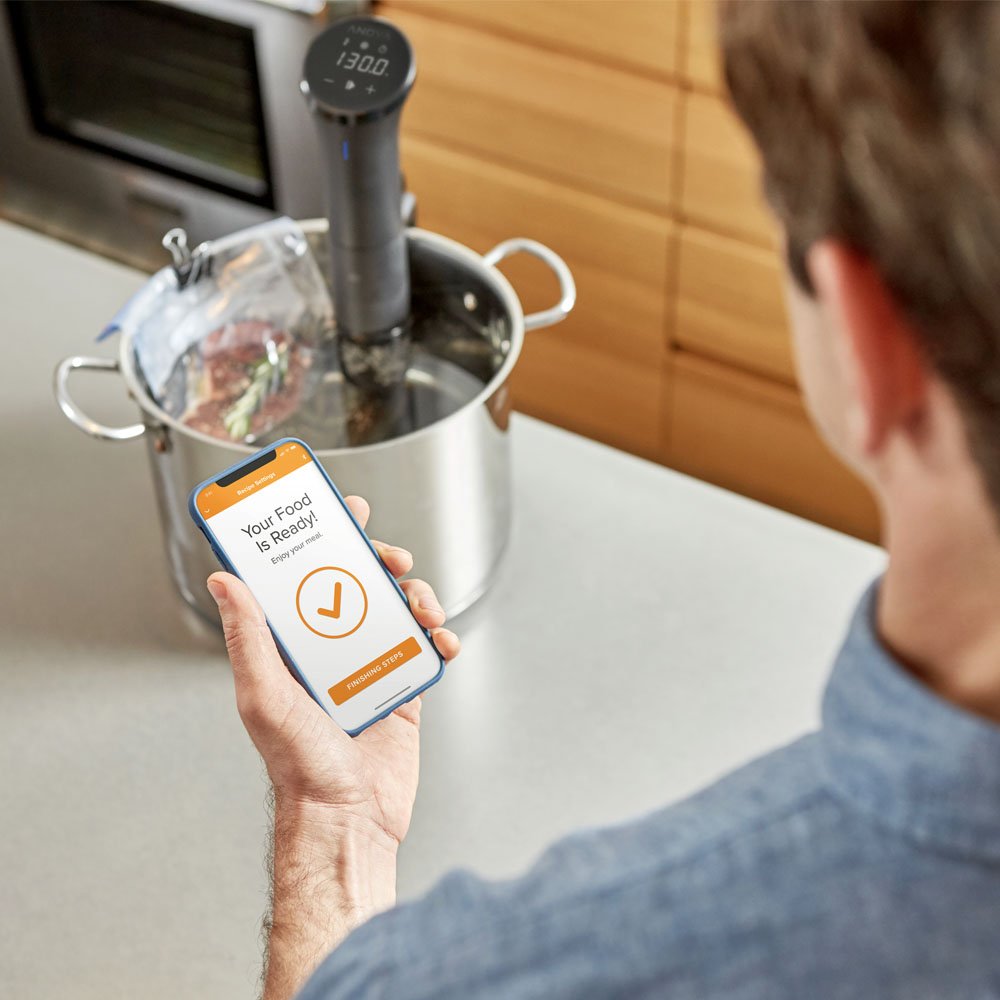 Anova Culinary Nano 2.0 with app control enabling hands-free sous vide cooking.