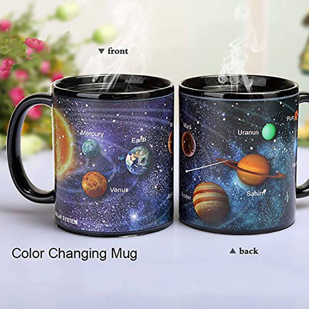 Antspirit solar-system mug closeup displays space-themed graphic during heat reveal.