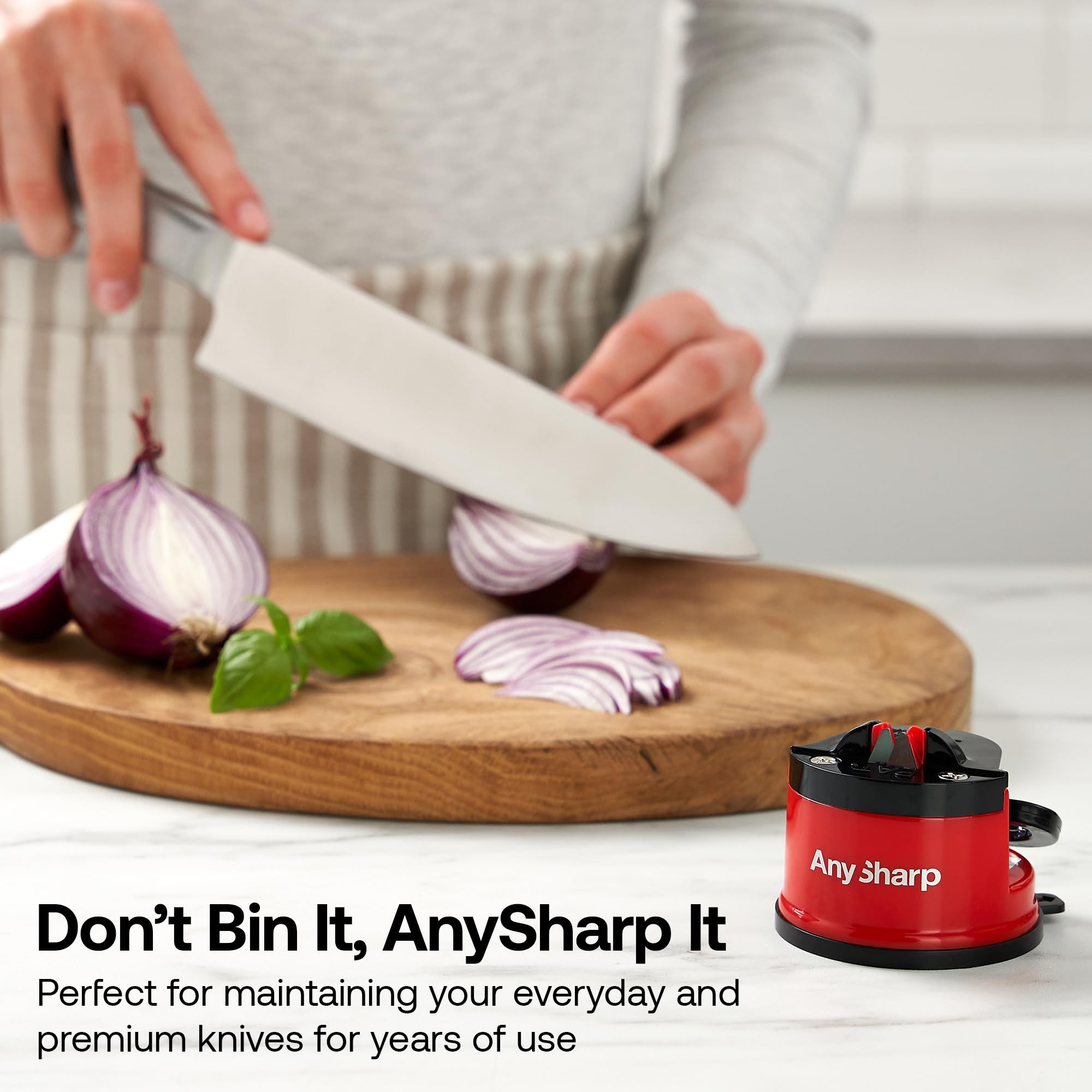 AnySharp Editions chef knife sharpening in a flash for smoother slicing.