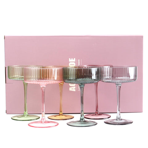 AOROTOE champagne coupe glasses, ribbed pink and yellow, perfect for vibrant entertaining.